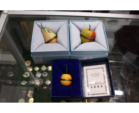 Three Halcyon Days fruit shaped enamel boxes.