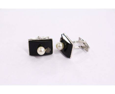 A pair of cufflinks.
