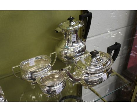 A plated four piece tea service.