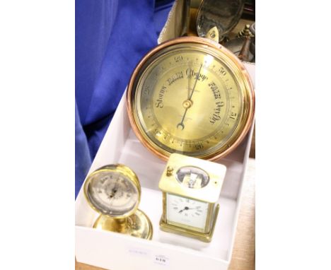 A copper and brass barometer, a desk barometer and a carriage clock.