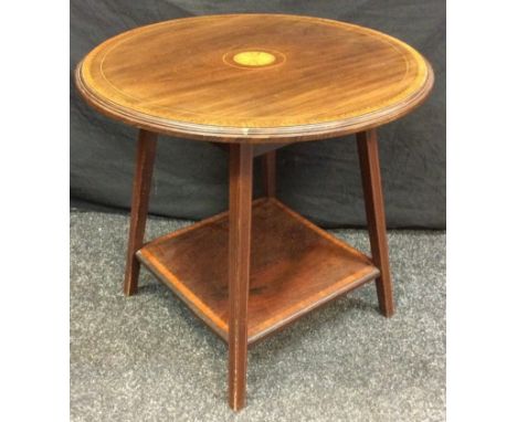 An Edwardian inlaid mahogany circular occasional table, block legs, undertier shelf, 54.5cm diameter, 50cm high. 