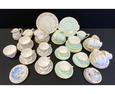 A Royal Worcester tea service, for six, printed with flowers;  another, Wedgwood Mirabelle;  a Minton tea service, in mint gr