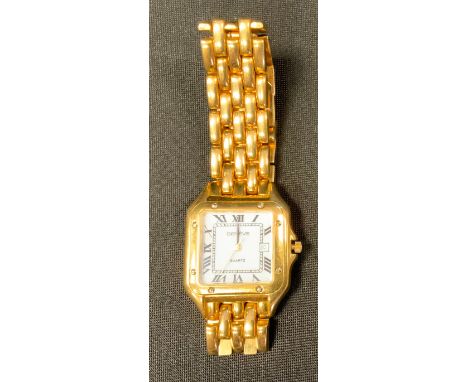 A Geneve gold coloured metal cased quartz wristwatch, square tank style case, white enamel dial, Roman numerals, date apertur