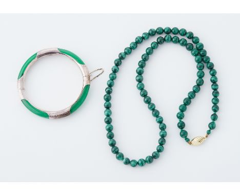 A 23" string of round 8mm malachite beads strung to a 9ct yellow gold clasp, 69.7gm and a silver &amp; dyed jade hinged bangl