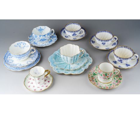 A collection of late Victorian and early 20th century tea cups, coffee cans and saucers, including a Wileman &amp; Co trio in