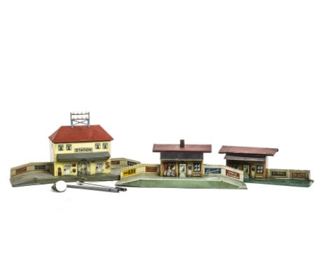 Three German-made 0 Gauge Tinprinted Stations, the larger example by Distler with station house, telegraph rack to roof and t