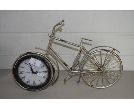 SMALL METAL MODEL OF A BICYCLE WITH CLOCK INSET TO FRONT WHEEL