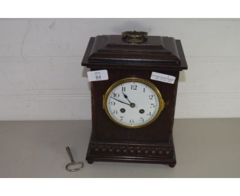 MANTEL CLOCK IN OAK CASE WITH SILVERED DIAL