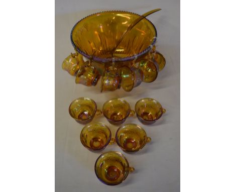 Carnival glass punch bowl with 12 cups and a plastic ladle