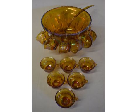 Carnival glass punch bowl with 12 cups and a plastic ladle