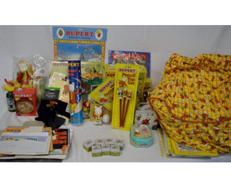 Large quantity of Rupert The Bear ephemera including a bean bag chair, calendars, badges, alarm clock etc