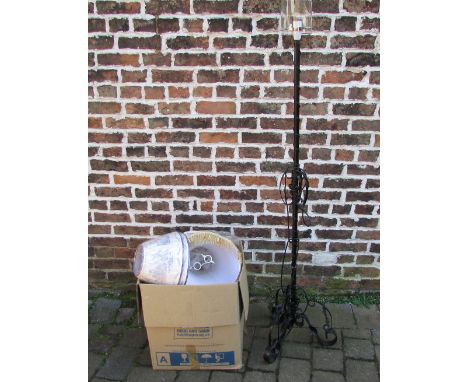 Black wrought iron standard lamp with box of assorted lamp shades
