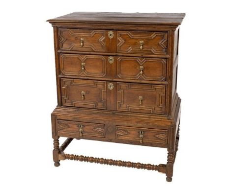 A 19th Century Williams &amp; Mary style Chest on Stand, the top with geometric panelled drawers with brass drop handles on a