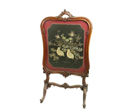 A cartouche shaped Victorian mahogany cheval Firescreen,&nbsp;with stump work and needle work panel on quadruple cabriole pod