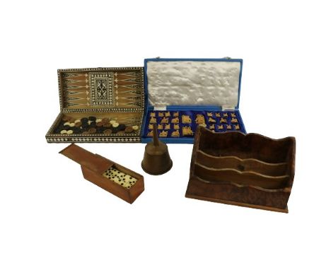 A Chess and Backgammon Games Box, in bone and ebony, together with draughts and backgammon pieces, a cased set of Indian carv