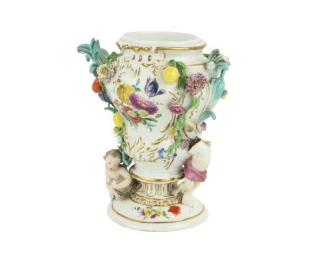 A 19th Century porcelain Meissen Vase,&nbsp;the floral encrusted design with cherubs and fruit, approx. 20cms (8'') high, som