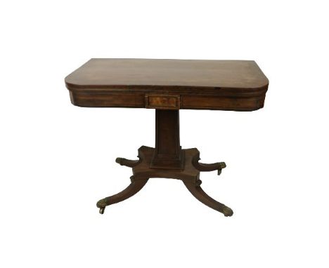 An Irish Provincial mahogany Regency period fold-over Card Table, probably Cork, the top with ebony string inlay, supported b