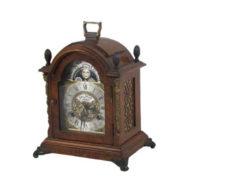 A Georgian style miniature Mantle Clock (ORM), with domed top brass, carrying handle and finial, the silvered and brass dial 