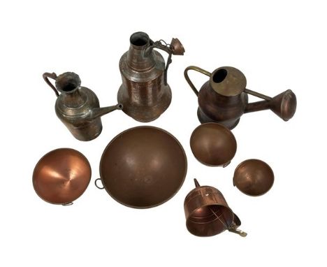 A collection of old Copperware, comprising a Garden Watering Can, a straining Funnel, an Iranian Jug, a Persian copper Pitche
