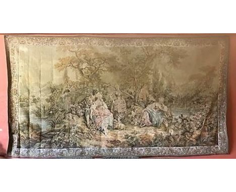 A fine large polychrome machine made Louis XV style Tapestry, depicting figures in a woodland scene by a fountain inside a fl