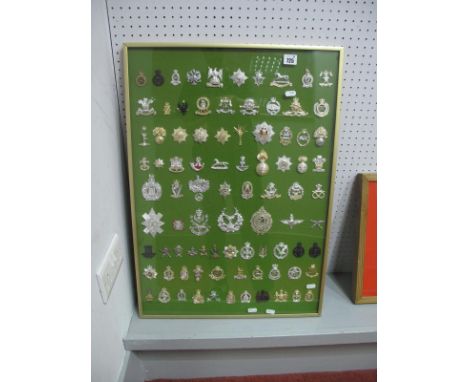 A Framed Collection of Eighty Seven British Army Regiments &amp; Corps Cap Badges, 1976 - 86, 72 x 52cm.