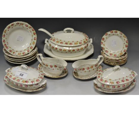 An early 20th century Continental miniature dinner service comprising of a tureen on stand; plates; soup bowls, sauce boats; 
