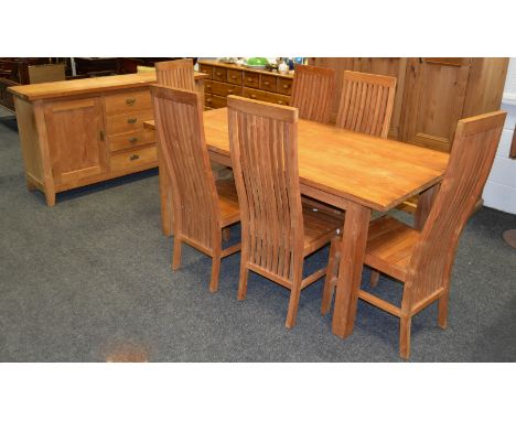 A  contemporary light oak dining room suite, comprising of a dining table, six high back chairs, sideboard