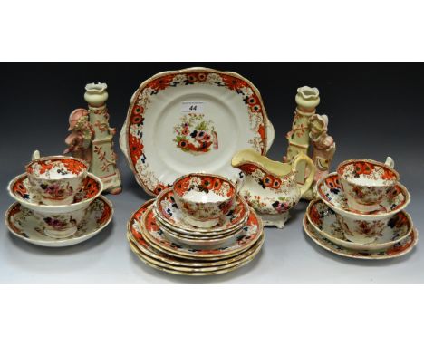 A pair of Continental bisque porcelain spill vases; a Victorian Staffordshire part tea service in the Imari palette c 1860