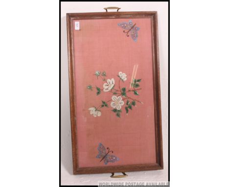 A large early 20th century oak and tapestry glass centre'd butlerys tray. The ends with twin handles having glass centre and 