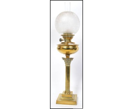 A stunning Juno early 20th century brass oil lamp of neo classical form with glass flue and stunning frosted and acid etched 