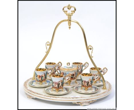A Capodimonte large tea service set on a large decorative ceramic tray with handle having cherub embellished cups etc. W44cm 