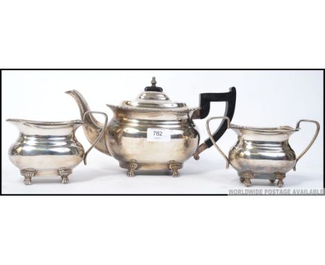 A silver plated tea service of good quality comprising teapot, sugar bowl and creamer by Viners. Stamped to the base.