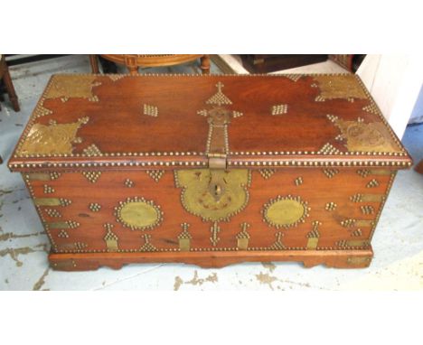 ZANZIBAR TRUNK, antique teak, brass bound and studded with hinged top and side handles, 42cm H x 92cm x 41cm.