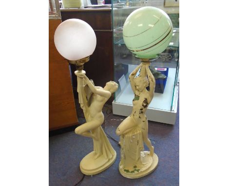 TABLE LAMPS, Art Deco, a set of two, painted with stylised nude figure holding globe shade aloft, each 73cm H overall. (with 