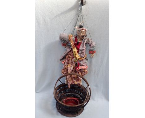 AN INDONESIAN WOOD CARVED PUPPET and two baskets