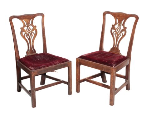 A PAIR OF GEORGE III MAHOGANY SIDE CHAIRS circa 1770, the backrests each formed as a pierced and Chinese Chippendale style fr