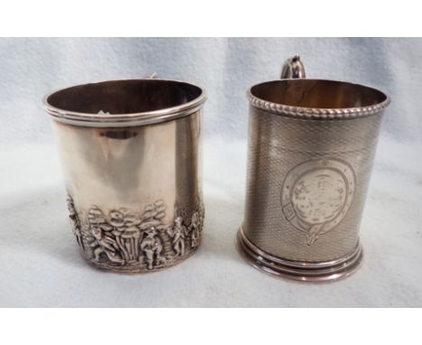 A VICTORIAN SILVER CHRISTENING MUG with engine turned decoration, and another with a repousse country scene (worn)
