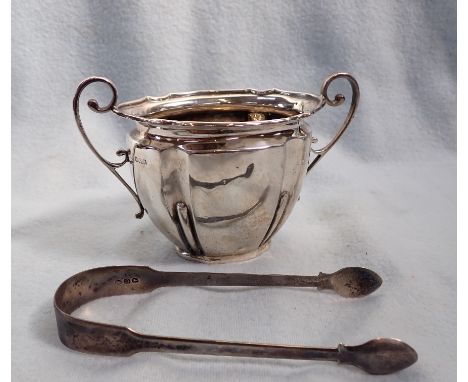 A PAIR OF GEORGIAN SILVER SUGAR TONGS and an Edwardian sugar basin