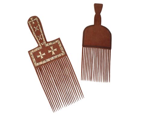 TWO LATE 19TH CENTURY SOLOMON TRIBAL HAND COMBS One with mother of pearl inlay decoration. The larger of the two 39cm Long an