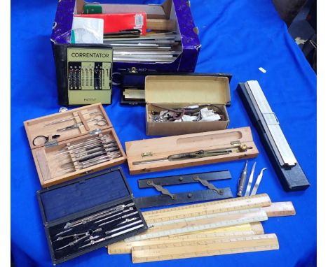 A SET OF PROPORTIONAL COMPASSES and a collection of slide rules and other drawing and scientific instruments, with boxwood ru
