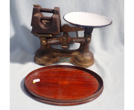 AN EDWARDIAN MAHOGANY MINIATURE TRAY with shell inlay, and a set of cast iron kitchen scales