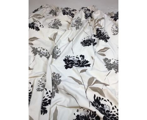 A pair of printed lined floral curtains in black and grey design with highlights of silver W:165cm x H:180cm approx 
