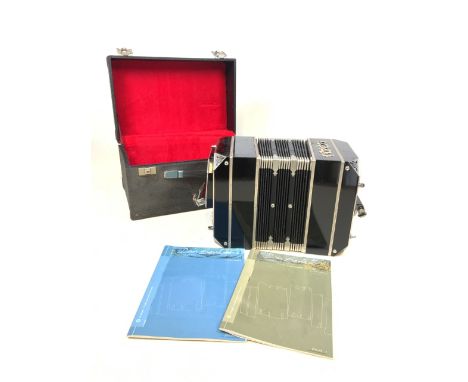 An accordion in fitted case. 