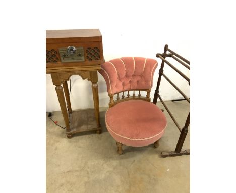 An upholstered nursing chair, side table, towel rail (a.f) also with a record and cd player.