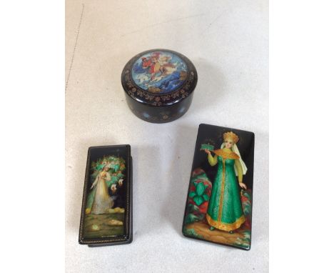 Two Russian lacquered boxes decorated with mystical women and a Ceramic music al trinket box 