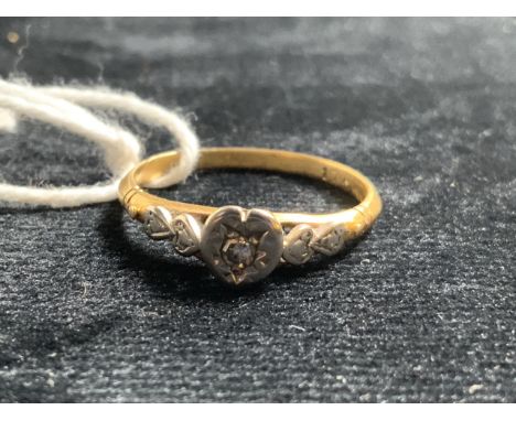 Heart shaped illusion set diamond ring on yellow metal shank marked 17. Size M. Total weight 3gm 
