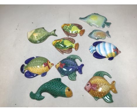 A quantity of ceramic fish W:20cm x H:14cm dims of largest 