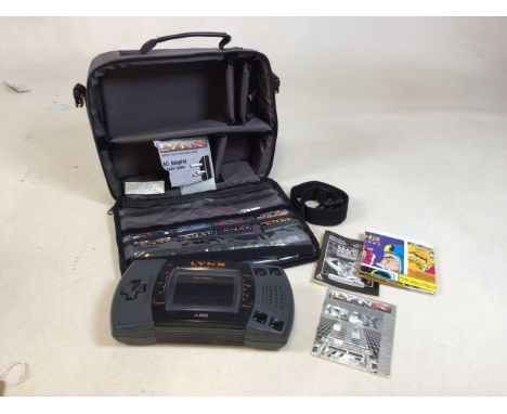 Atari Lynx games console with eight games. No power lead. Also with a ConnectTv Cricket. Untested