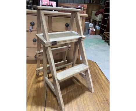 A set of metamorphic library steps, folding into a chair. Step height H:69cm
