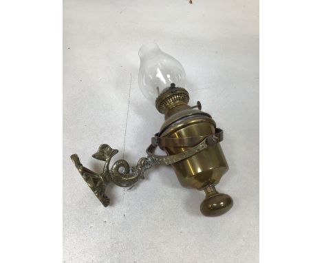 A vintage nautical style oil lamp on gimbal with decorative fish holder. Stamped Sherwood BirminghamH:31cm